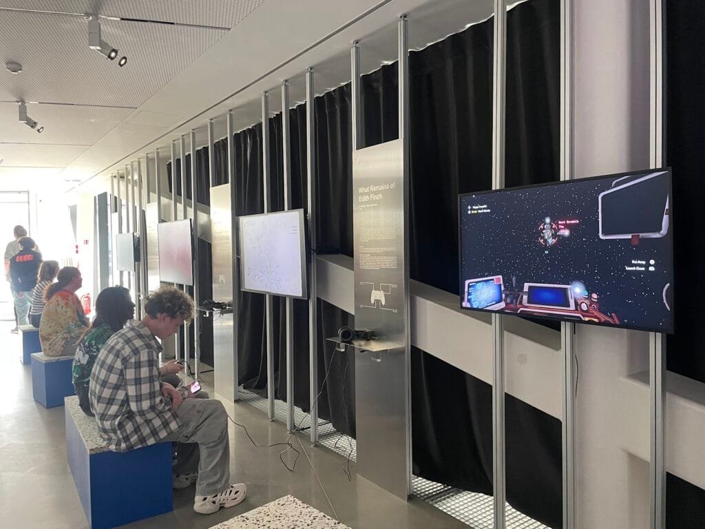 Visitors playing video games at an interactive exhibition in MO Museum.