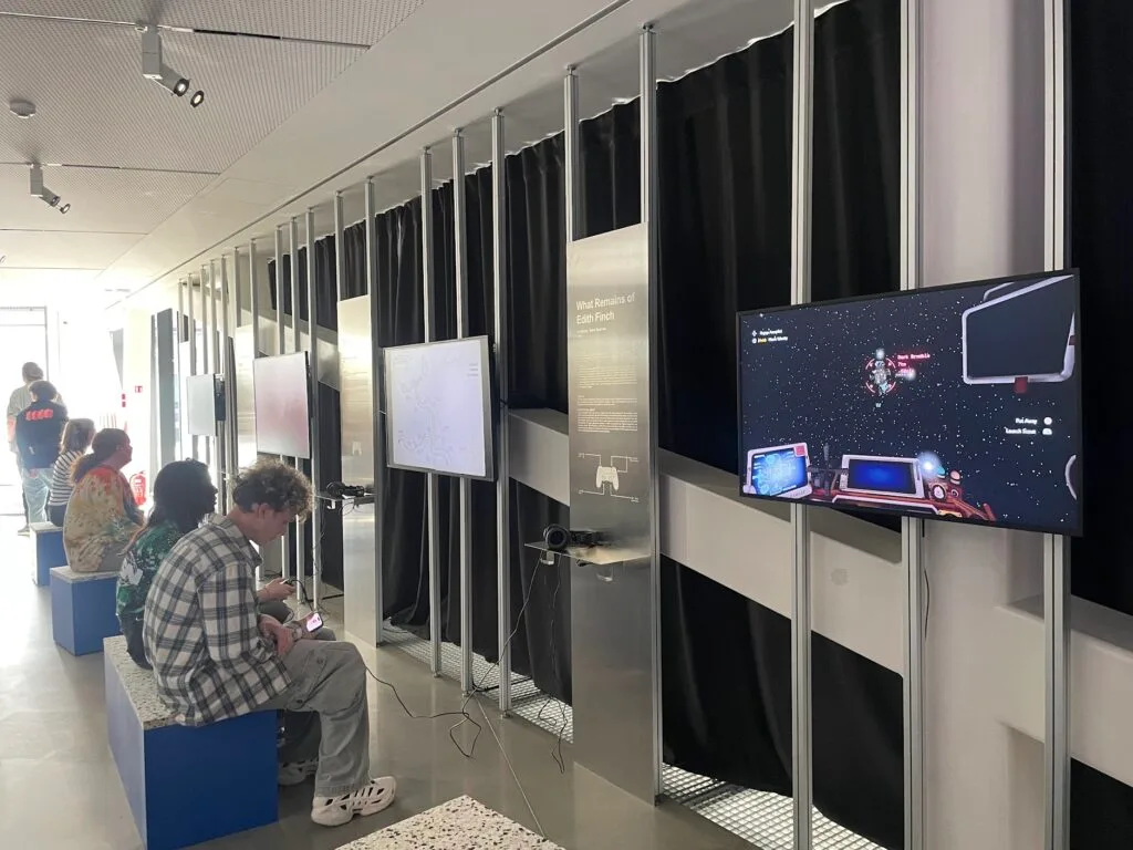 Visitors playing video games at an interactive exhibition in MO Museum.
