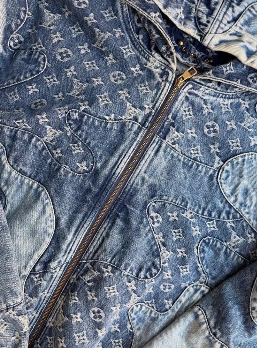Denim jacket with monogram patterns from a vintage clothing collection.