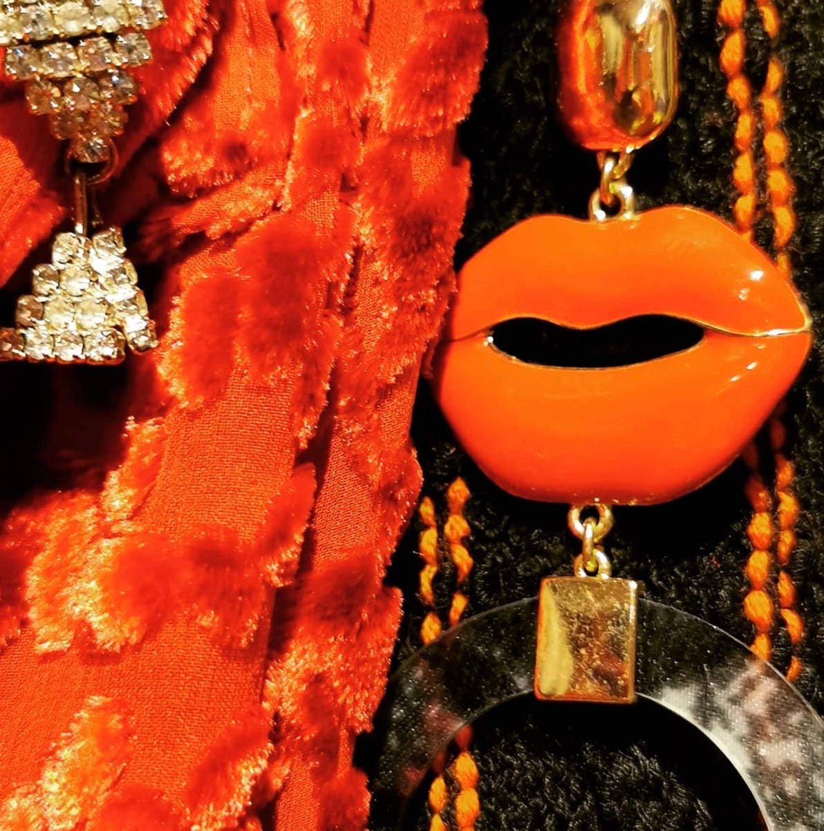 Unique lip-shaped earrings and sparkling jewelry in a vintage accessories shop.