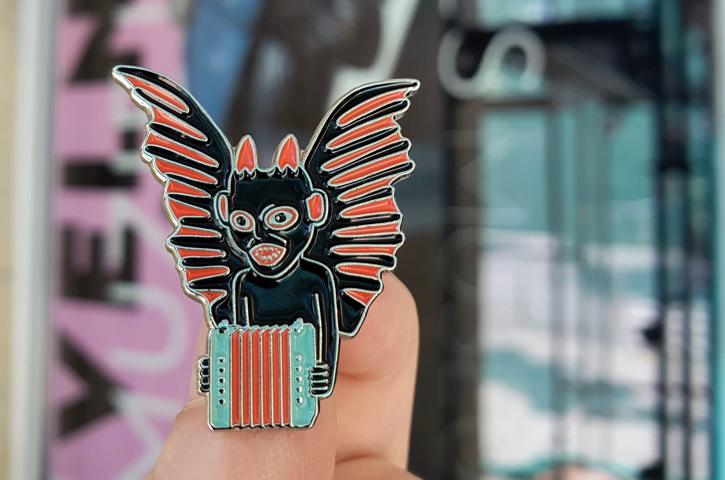 Devil-shaped souvenir pin with accordion at Devils' Museum.