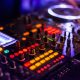 DJ mixer with colorful lights at a club event highlighting the Best Parties in Vilnius for an unforgettable night out