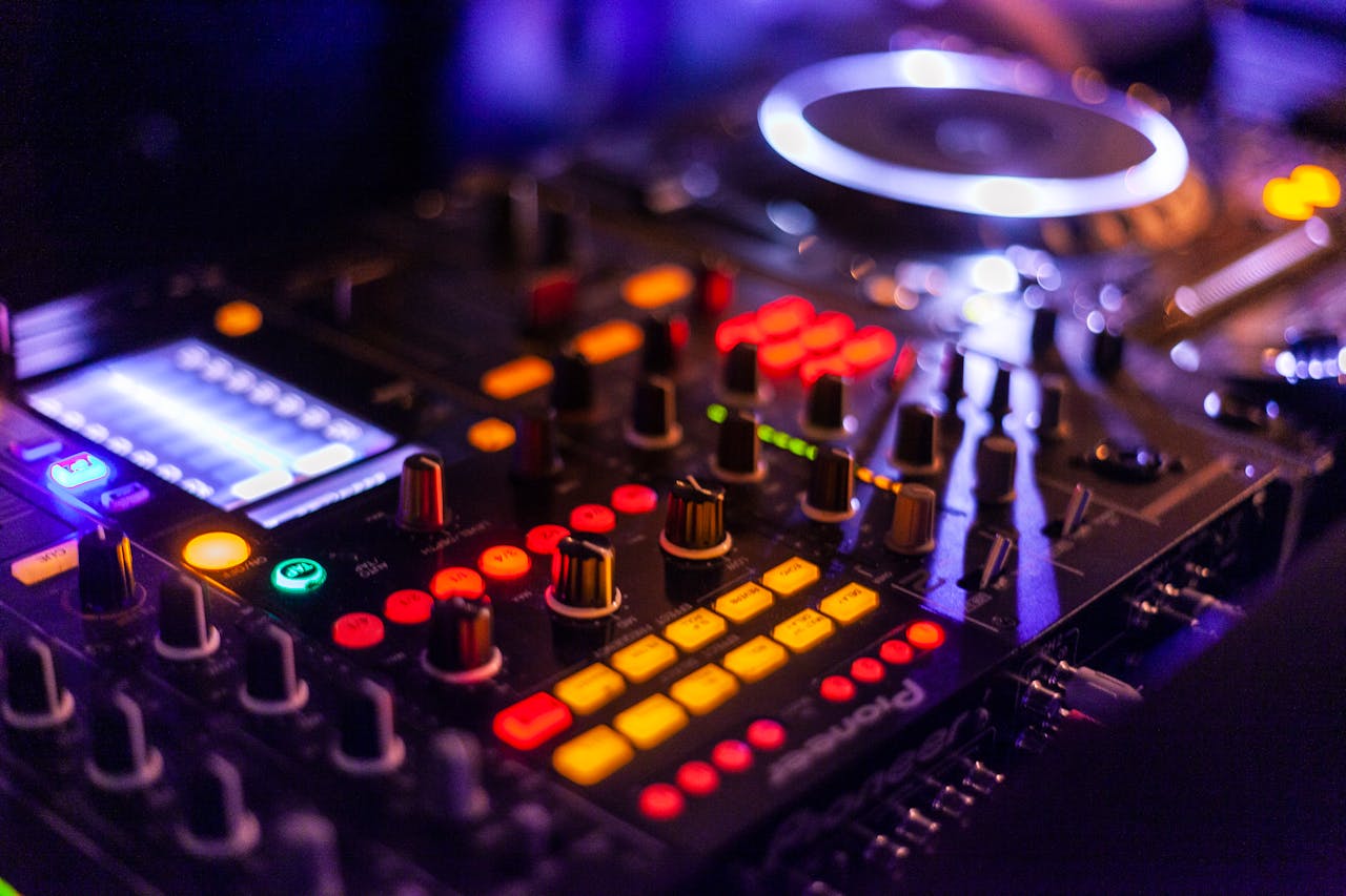 DJ mixer with colorful lights at a club event highlighting the Best Parties in Vilnius for an unforgettable night out