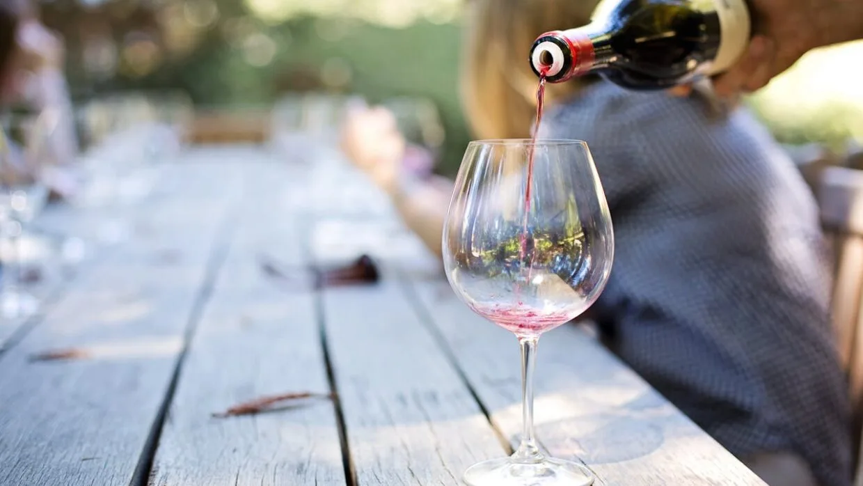 Enjoying wine at a cozy wine bar in Vilnius Old Town - discover best wine bars in Vilnius