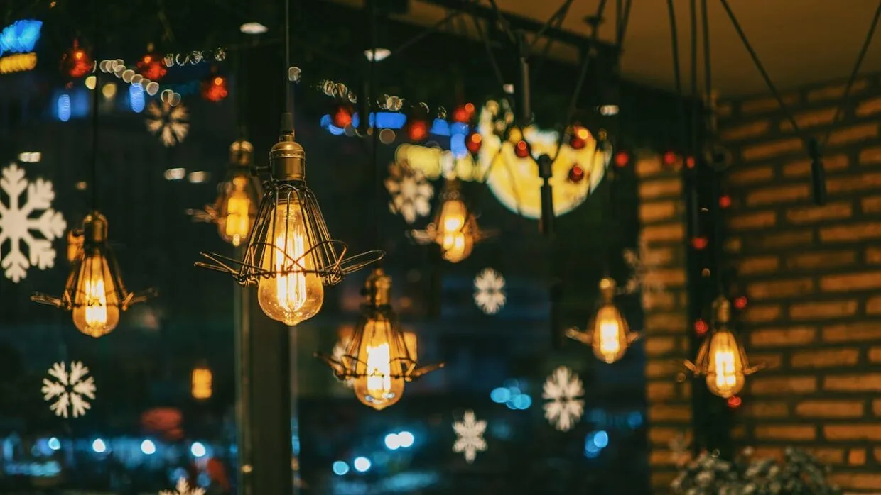 Christmas in Vilnius with festive lights, market stalls, and people enjoying the holiday atmosphere in Cathedral Square.