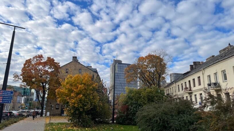 Vilnius skyline with modern offices and green spaces — one of the best cities in Lithuania for expats to work.