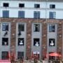 Kaunas cultural festivals - dancers performing a vertical dance show on a building facade