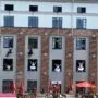 Kaunas cultural festivals - dancers performing a vertical dance show on a building facade