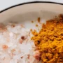 Coarse pink Himalayan salt and ground turmeric - Indian restaurants in Vilnius.