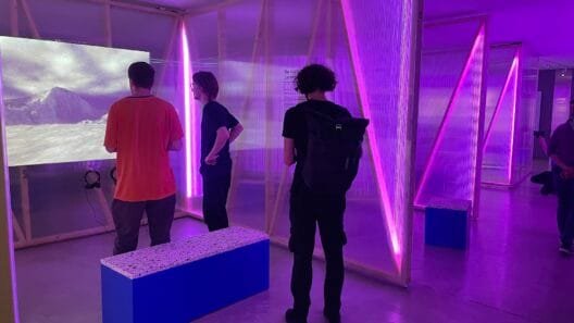 Visitors exploring interactive video installations in a modern museum - museums for kids in Vilnius.