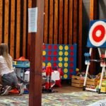 Girl playing in a designated kids' play area with toys and games - family friendly restaurants in Kaunas.
